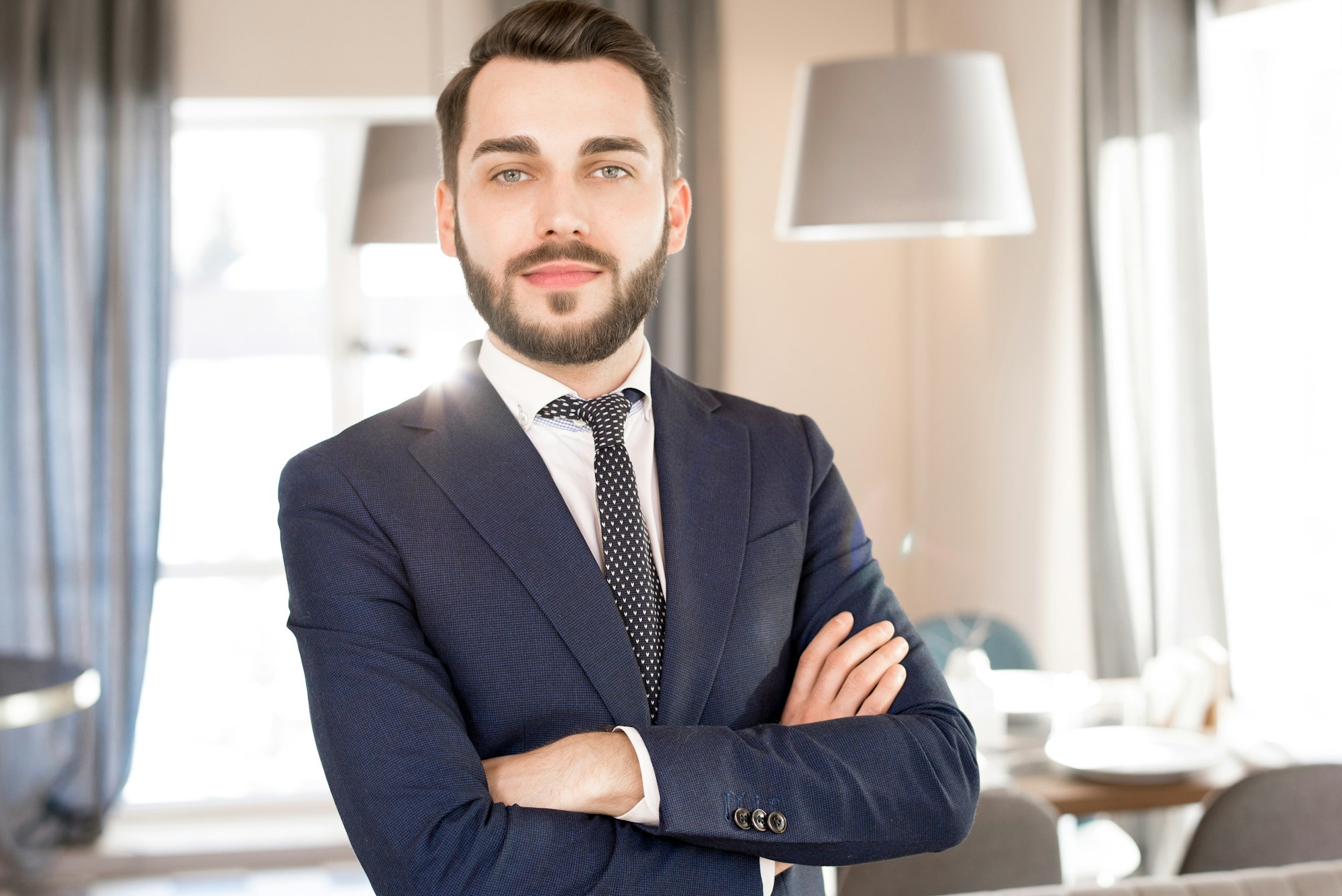 Content handsome bearded business manager