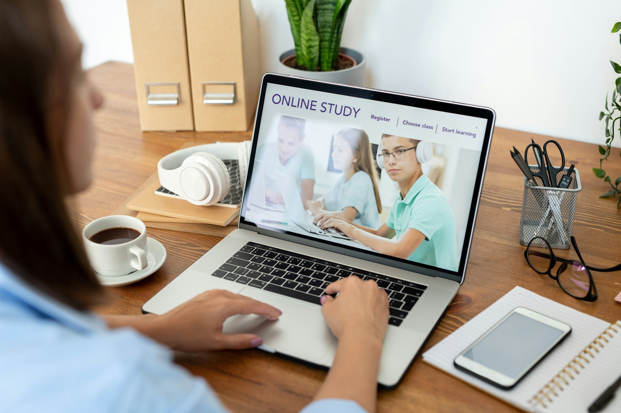 Young woman surfing in the net while using website of distant learning