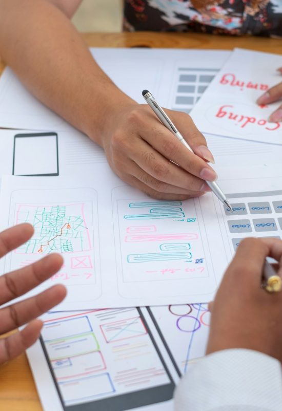 designer team drawing website ux app development application for mobile phone designer team drawing website ux app development application for mobile phone
